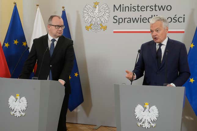 European Commissioner for Justice, Didier Reynders, right, and Poland&#39;s new Justice Minister Adam Bodnar take part in a news conference, in Warsaw, Poland, Friday Jan. 19, 2024. Reynders has praised efforts by Poland&#39;s new pro-EU government to restore rule of law and said they may lead to the release of some of EU funds for the country that were frozen under the previous recalcitrant administration. (AP Photo/Czarek Sokolowski)