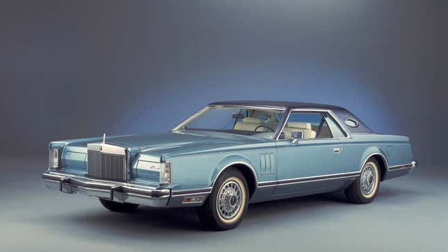 A photo of a blue Lincoln Continental. 