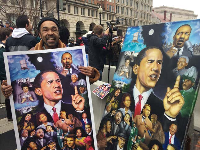 Terry Wilson carries a portrait of Barack Obama to the inauguration of Donald Trump on Friday. Jan. 20, 2016.