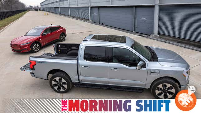 A photo of Ford's electric F-150 Lightning pickup charging up a Mustang Mach-E. 