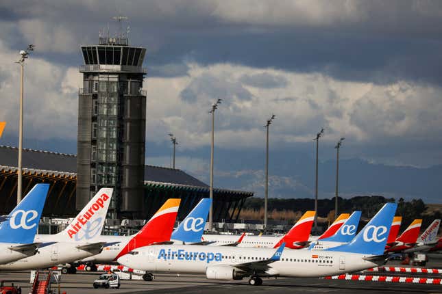 Iberia and Air Europa airplanes parked at the airport in Madrid, Spain.