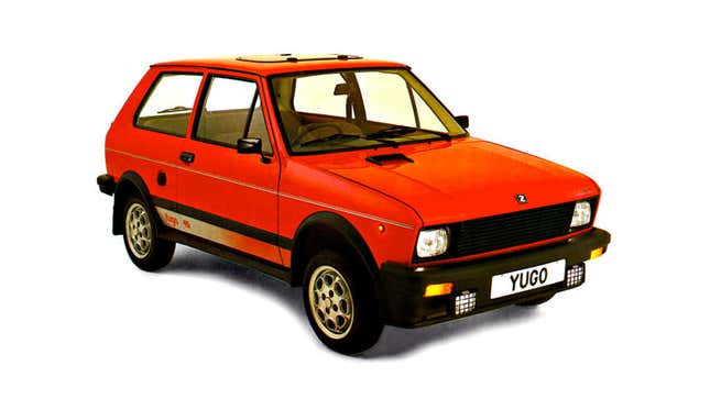 A photo of a red Yugo hatchback. 