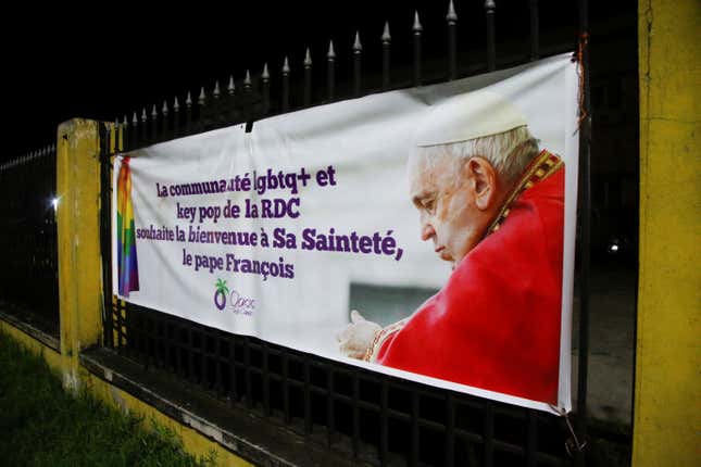 A banner that reads “The LGBTQ+ and key pop community of the DRC welcomes His Holiness Pope Francis” is displayed in Kinshasa.