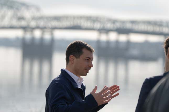 U.S. Transportation Secretary Pete Buttigieg speaks with members of the media with the century-old Interstate 5 bridge behind him on Tuesday, Feb. 13, 2024, in Vancouver, Wash. Buttigieg toured the century-old Interstate 5 bridge that connects Portland, Ore., with southwest Washington state, a vital but earthquake-vulnerable structure that&#39;s set to be replaced as part of a multibillion-dollar project supported by federal funding. (AP Photo/Jenny Kane)