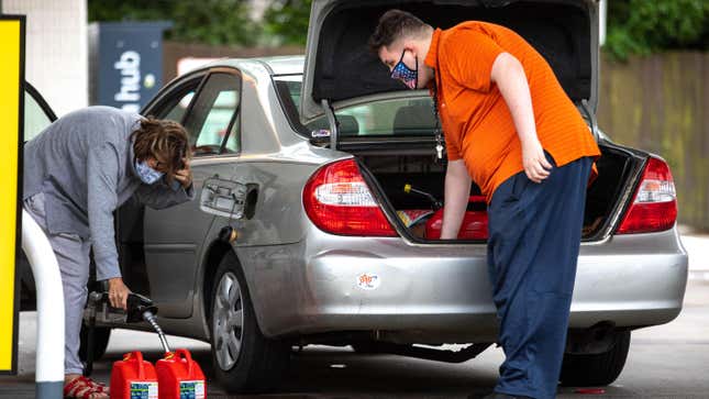 People filling up gas containers in Charlotte, North Carolina, on Wednesday.