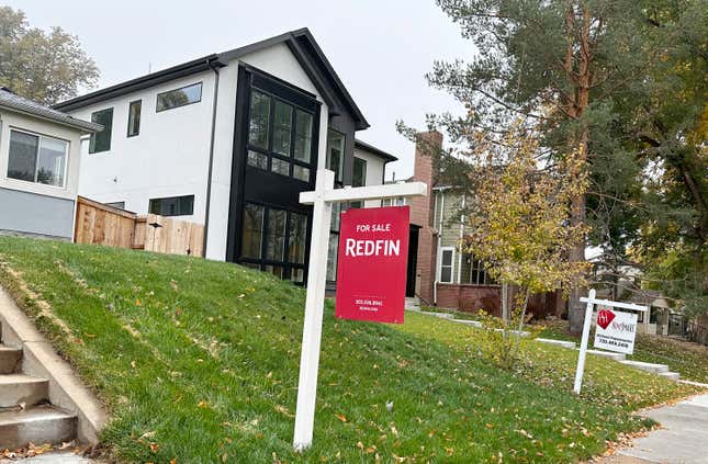 Signs stand in front of homes for sale along South St. Paul Street Thursday, Oct. 26, 2023, in southeast Denver. On Thursday, Freddie Mac reports on this week&#39;s average U.S. mortgage rates. (AP Photo/David Zalubowski)