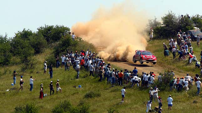 A photo of Richard Burns racing his rally car. 