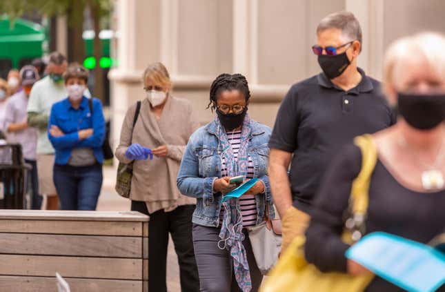 ARLINGTON, VIRGINIA, USA - SEPTEMBER 18, 2020: People line up during first day of early voting, 2020 presidential election.
