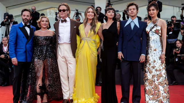 From left to right: Nick Kroll, Florence Pugh, Chris Pine, Olivia Wilde, Sydney Chandler, Harry Styles and Gemma Chan on the red carpet before the premiere of Don’t Worry Darling at the Venice Film Festival on Monday.