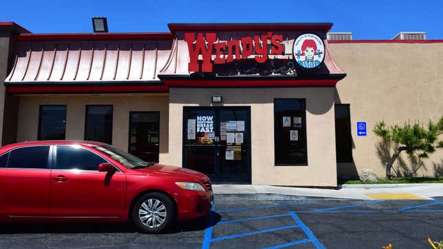 A car approaches the drive-thru at a Wendy's 