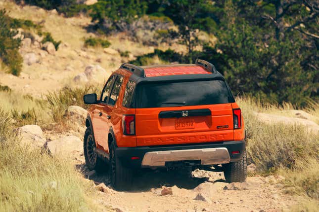 Rear end of an orange 2026 Honda Passport TrailSport