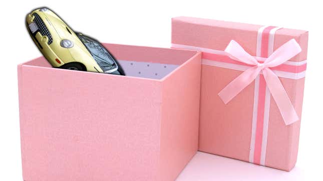 Pink gift box, containing a 2002 Ford Thunderbird in bright yellow.