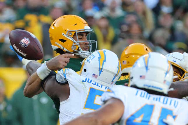GREEN BAY, WISCONSIN - NOVEMBER 19: Jordan Love #10 of the Green Bay Packers is stripped of the ball by Khalil Mack #52 of the Los Angeles Chargers during a game at Lambeau Field on November 19, 2023 in Green Bay, Wisconsin. The Packers defeated the Chargers 23-20. (Photo by Stacy Revere/Getty Images)