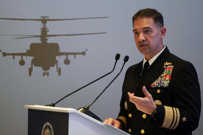 FILE - U.S. Navy Vice Adm. Brad Cooper, who heads the Navy&#39;s Bahrain-based 5th Fleet, speaks at an event at the International Defense Exhibition and Conference in Abu Dhabi, United Arab Emirates, Feb. 21, 2023. The top commander of U.S. naval forces in the Middle East says Yemen’s Houthi rebels are showing no signs of ending their “reckless” attacks on commercial ships in the Red Sea. But Vice Adm. Brad Cooper said in an Associated Press interview on Saturday that more nations are joining the international maritime mission to protect vessels in the vital waterway and trade traffic is beginning to pick up. (AP Photo/Jon Gambrell, File)