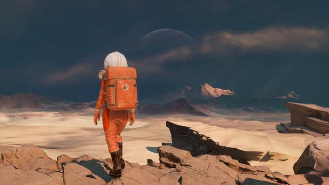 Our orange-suited astronaut looks out at desert dunes.