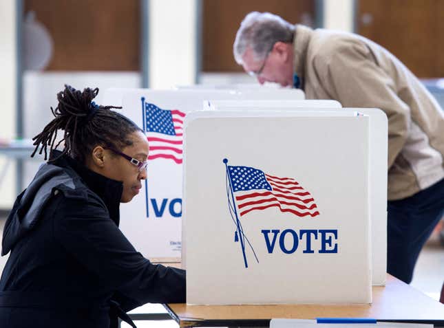 People vote in the Super Tuesday primary at Centreville High School March 1, 2016, in Centreville, Virginia. Voters in a dozen states will take part in “Super Tuesday” — a series of primaries and caucuses in states ranging from Alaska to Virginia, with Virginia the first to open its polling stations at 6:00 am (1100 GMT).