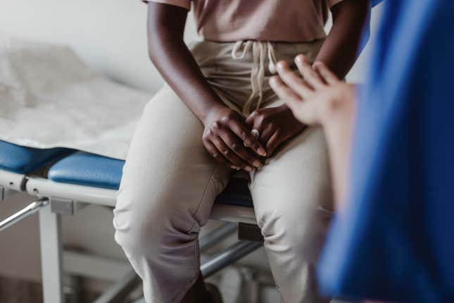 Black woman being examined at hospital 