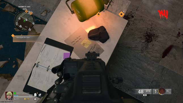 A screenshot showing the location of a sticky note with the vault combination on it. This one is located just outside the vault in the middle of the bank on a counter top.