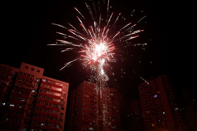 Fireworks light up a residential apartments during the Chinese New Year’s Eve in Beijing.