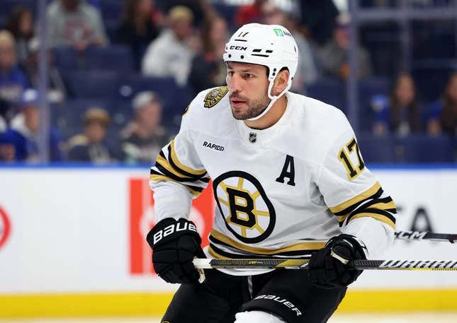 Sep 26, 2023; Buffalo, New York, USA;  Boston Bruins left wing Milan Lucic (17) looks for the puck during the first period against the Buffalo Sabres at KeyBank Center.