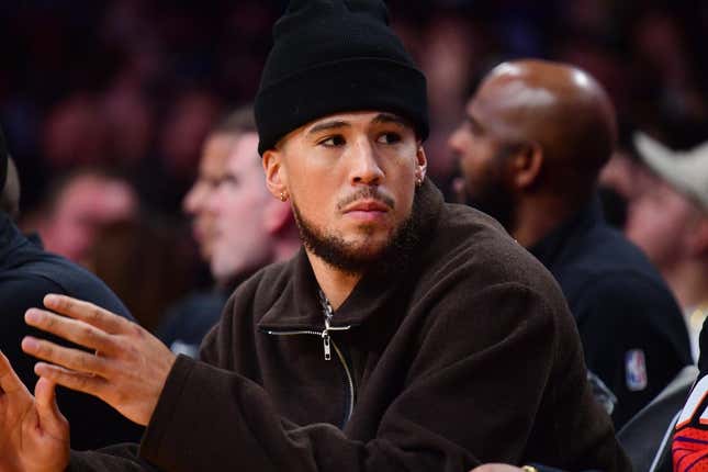 Oct 26, 2023; Los Angeles, California, USA; Phoenix Suns guard Devin Booker (1) watches game action against the Los Angeles Lakers during the first half at Crypto.com Arena.