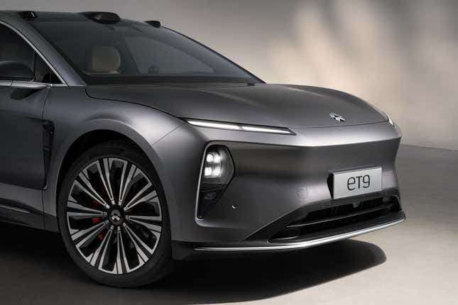 Detail view of the front end and wheels of a grey Nio ET9