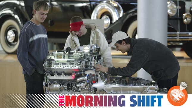 Youths look on in wonder at a high-market VW engine in the early 2000s.