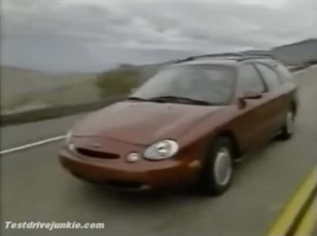 A screenshot of a Motorweek test of a red Ford Taurus wagon 