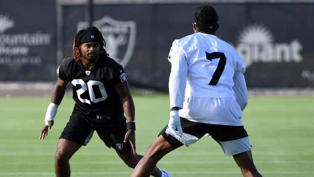 Las Vegas Raiders corner back Damon Arnette (20) and wide receiver Zay Jones perform a drill during an NFL football practice Wednesday, July 28, 2021, in Henderson, Nev. 