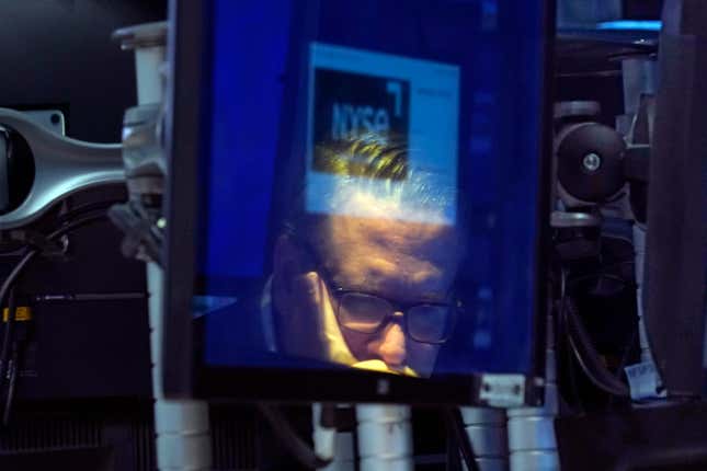 File - Specialist Gregg Maloney is reflected in a video screen on the floor of the New York Stock Exchange, on Sept. 13, 2023. (AP Photo/Richard Drew, File)