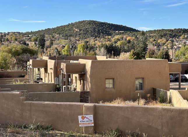 A political campaign sign highlights the local election season in Santa Fe, N.M., on Friday, Nov. 3, 2023. Voters are deciding whether to tax mansions to pay for affordable housing initiatives in a state capital city prized for its desert-mountain vistas, vibrant arts scene and stucco architecture rooted in Native American and Spanish-colonial tradition. (AP Photo/Morgan Lee)