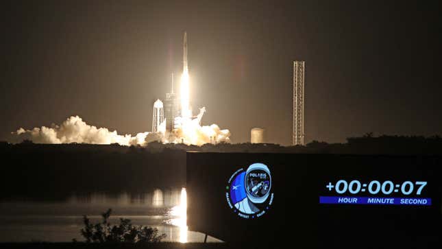 A photo showing a SpaceX rocket launching at night. 