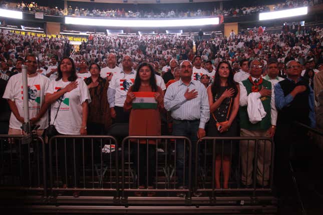 Modi supporters observe the US national anthem. Most attendees were Indian Americans from New York and neighboring states.