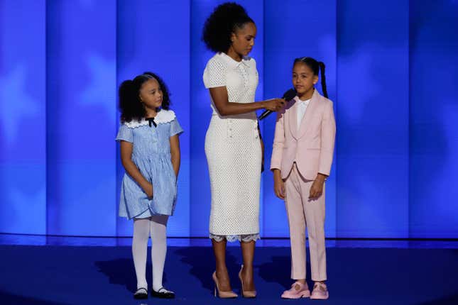 CHICAGO, ILLINOIS - AUGUST 22: Actor Kerry Washington speaks on stage with Democratic presidential candidate, U.S. Vice President Kamala Harris’ grandnieces Amara Ajagu (R) and Leila Ajagu (L) during the final day of the Democratic National Convention at the United Center on August 22, 2024 in Chicago, Illinois. 