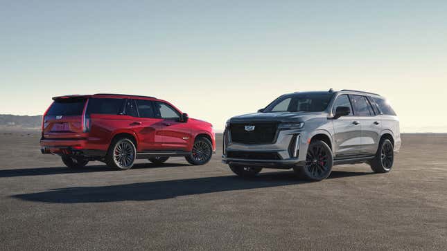 A photo of two Cadillac Escalade SUVs 