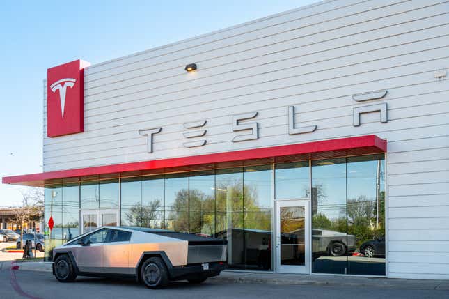  A Tesla Cybertruck is parked in front of a dealership on March 20, 2025 in Austin, Texas.