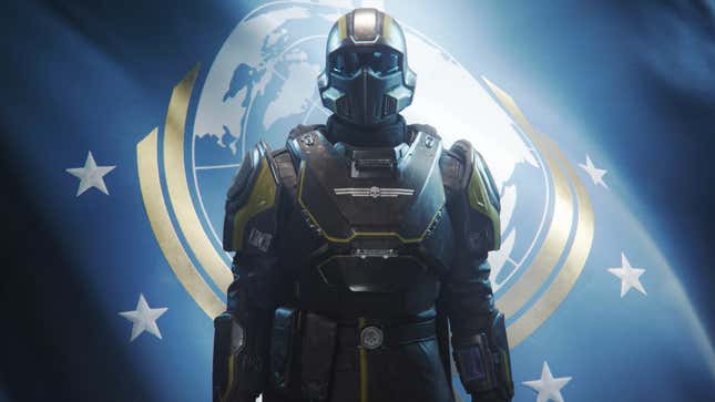 A Helldiver stands in full armor in front of a flag of Super Earth.