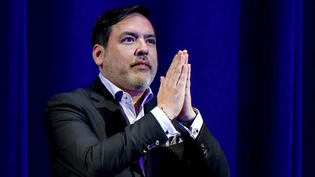 Former PlayStation CEO Shawn Layden holds his hands together in a prayer position during Sony's E3 2017 presentation.