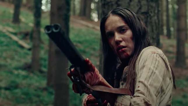 A blood-covered woman holds a shotgun in a screengrab from Netflix's spooky A Classic Horror Story.