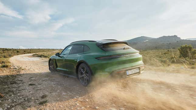 A photo of a green Porsche Taycan Turbo S Cross Turismo. 