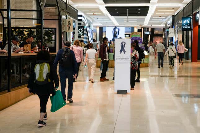 People walk inside the Westfield shopping mall at Bondi Junction in Sydney, Friday, April 19, 2024. The Sydney shopping mall reopened for business on Friday for the first time since it became the scene of a mass stabbing in which six people died on Saturday, April 13. (AP Photo/Mark Baker)