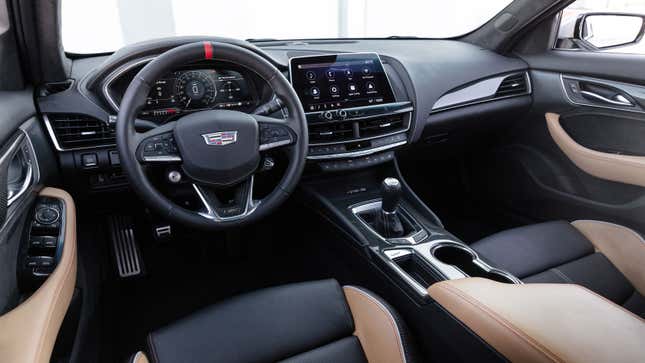 A photo of the interior of a Cadillac car. 