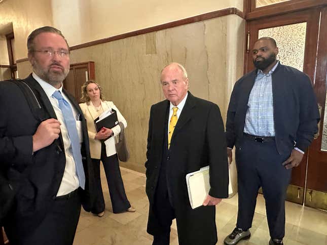 Former NFL football player Michael Oher, right, stands with his lawyers outside a courtroom, Wednesday, Nov. 29, 2023, in Memphis, Tenn. A lawyer for the Memphis couple who took in former NFL player Michael Oher when he was in high school said Wednesday, Nov. 29, 2023, that references to Oher being their adopted son will be removed from the couple’s websites and public speaking materials as part of their legal battle over Oher’s finances. (AP Photo/Adrian Sainz)