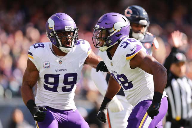 CHICAGO, ILLINOIS – OCTOBER 15: Danielle Hunter #99 and DJ Wonnum #98 of the Minnesota Vikings celebrate a sack against the Chicago Bears at Soldier Field on October 15, 2023 in Chicago, Illinois.  (Photo by Michael Reaves/Getty Images)