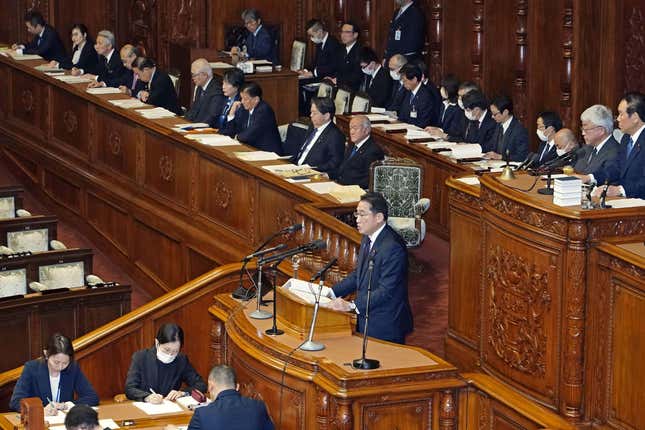 Japan&#39;s Prime Minister Fumio Kishida, on platform, delivers his policy speech at parliament in Tokyo Tuesday, Jan. 30, 2024. (Kyodo News via AP)