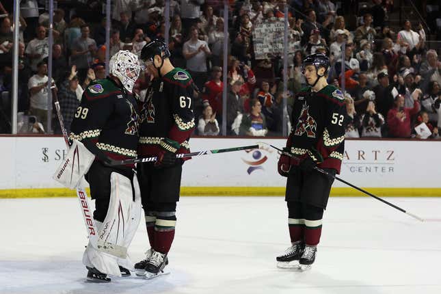 TEMPE, ARIZONA - APRIL 17: Goaltender Connor Ingram #39 of the Arizona Coyotes is congratulated by Lawson Crouse #67 and Vladislav Kolyachonok #52 after defeating the Edmonton Oilers in the NHL game at Mullett Arena on April 17, 2024 in Tempe, Arizona. The Coyotes defeated the Oilers 5-2. (Photo by Christian Petersen/Getty Images)