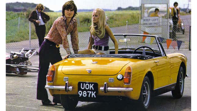 A photo of a yellow MG Midget sports car. 