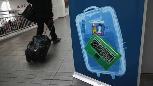 A photo of a suitcase after it has been scanned through an x-ray machine. 