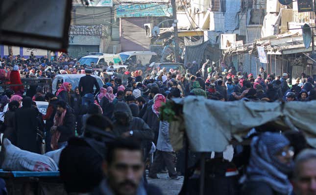 People gather to be evacuated from al-Sukkari rebel-held sector of eastern Aleppo. (Reuters/Abdalrhman Ismail)