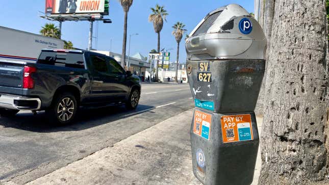 A photo of a parking meter on Sunset Blvd with a QR code on it